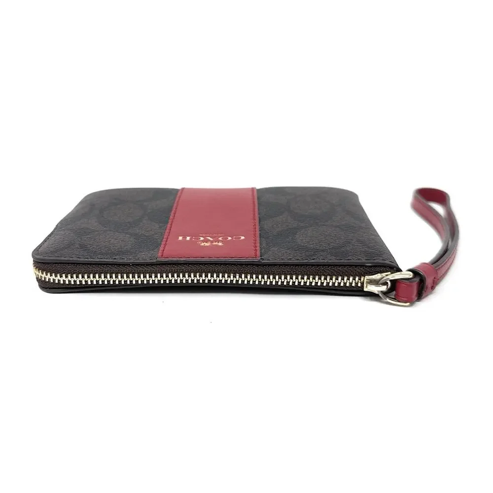 Coach Corner Zip Wristlet In Signature Canvas Brown Red